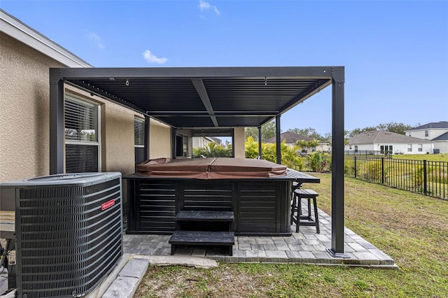 view of patio with central AC and a hot tub