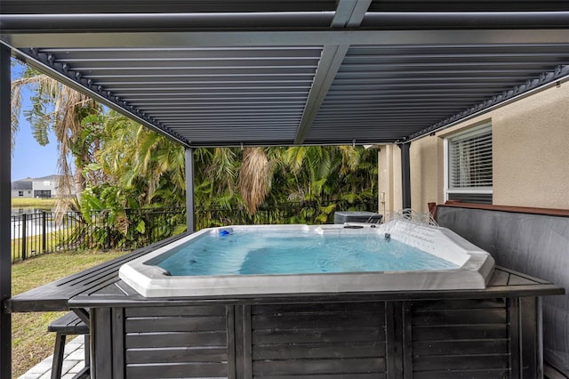 view of pool featuring a hot tub