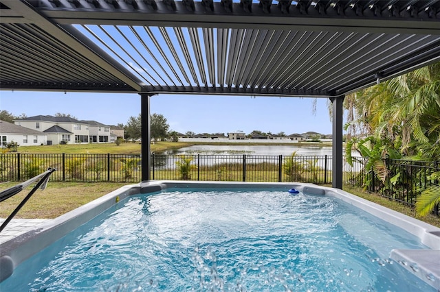 view of pool with a water view