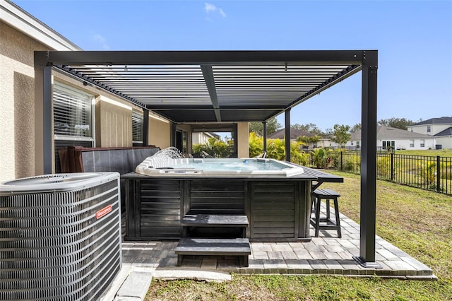 view of patio / terrace featuring a hot tub and central air condition unit