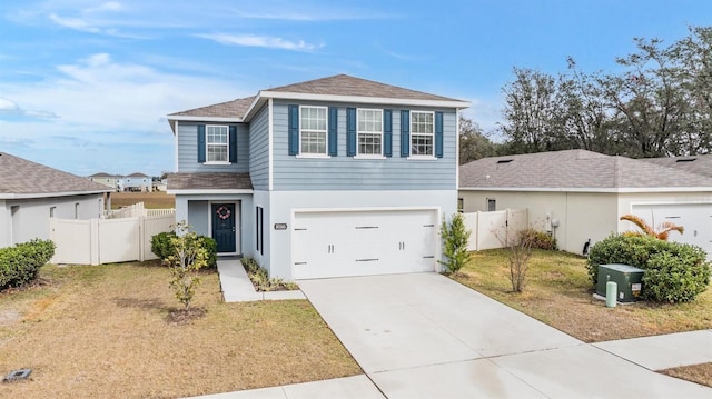 view of front of house with a garage and a front yard