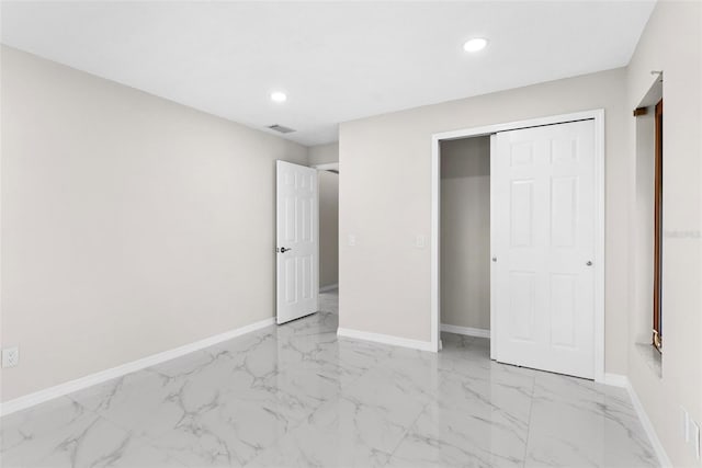 unfurnished bedroom with a closet