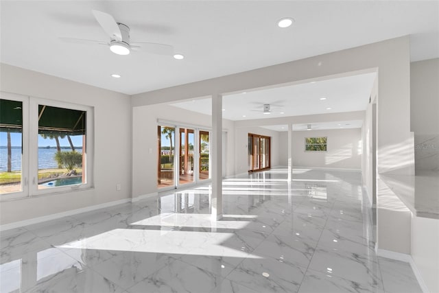 empty room with baseboards, marble finish floor, a ceiling fan, and recessed lighting