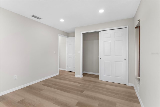 unfurnished bedroom with baseboards, recessed lighting, visible vents, and light wood-style floors