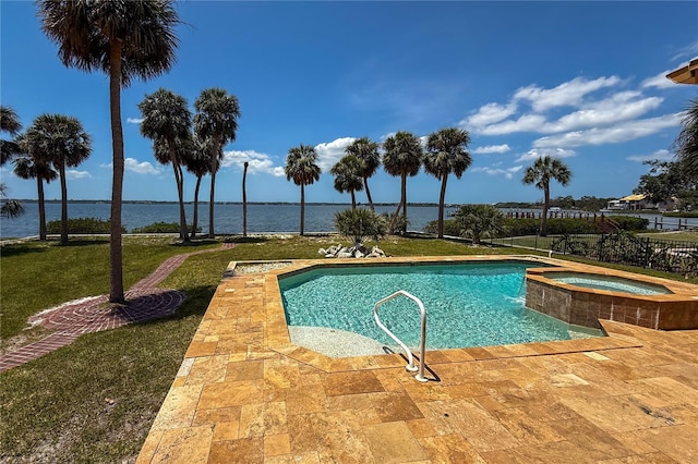 316 Shore Dr E, Oldsmar, FL 34677 - view of swimming pool featuring fence, a pool with connected hot tub, a water view, a patio area, and a yard