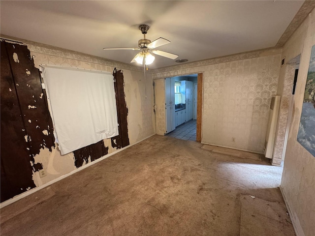 carpeted empty room with ceiling fan