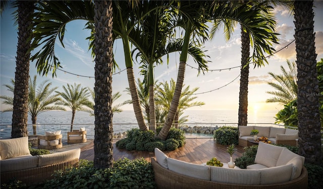 patio terrace at dusk with a water view and an outdoor hangout area