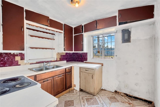 kitchen with sink, light tile patterned floors, and backsplash