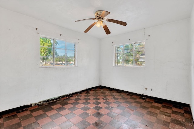 spare room with ceiling fan