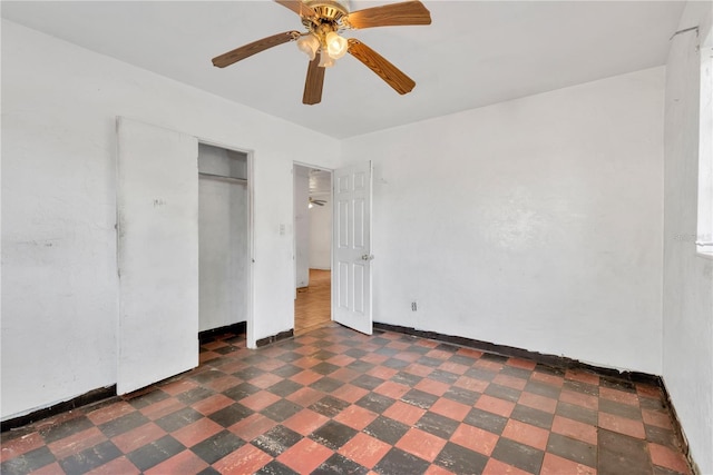 unfurnished bedroom featuring ceiling fan