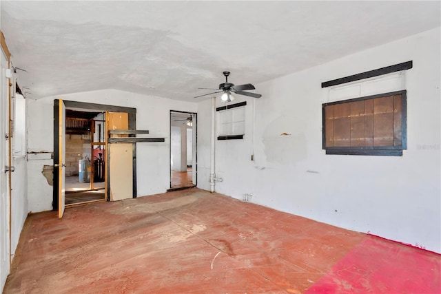 unfurnished bedroom featuring ceiling fan and vaulted ceiling