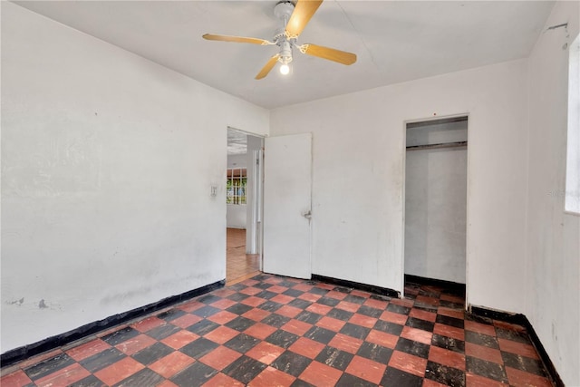 unfurnished bedroom with a closet and ceiling fan