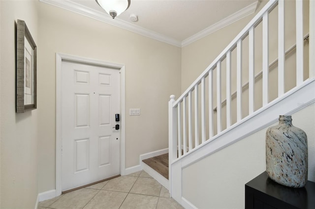 tiled entrance foyer with ornamental molding