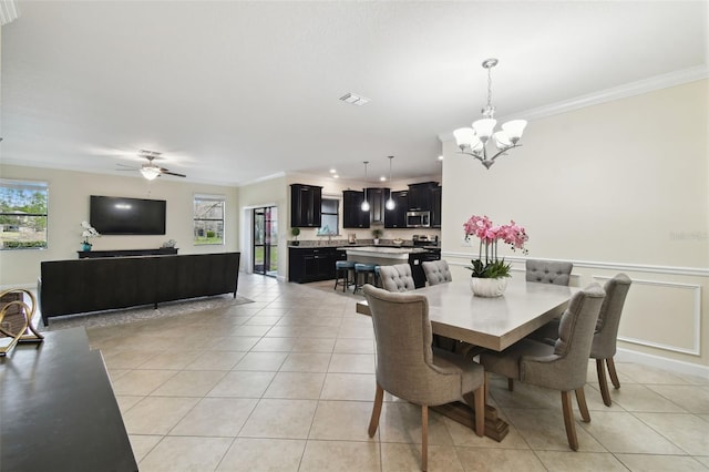 tiled dining room featuring ceiling fan with notable chandelier and ornamental molding