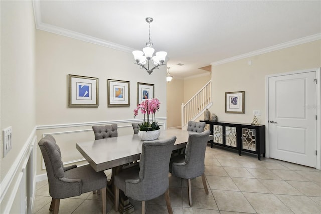 dining room featuring ornamental molding, light tile patterned floors, and a notable chandelier