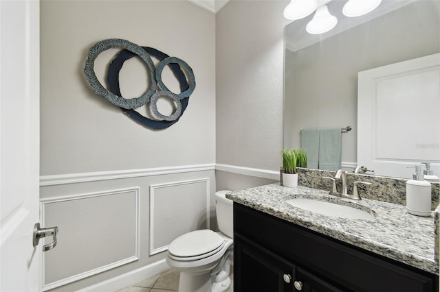 bathroom with vanity, tile patterned floors, and toilet