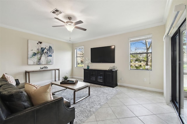 tiled living room featuring ceiling fan and ornamental molding