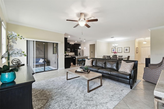 tiled living room with ornamental molding and ceiling fan with notable chandelier