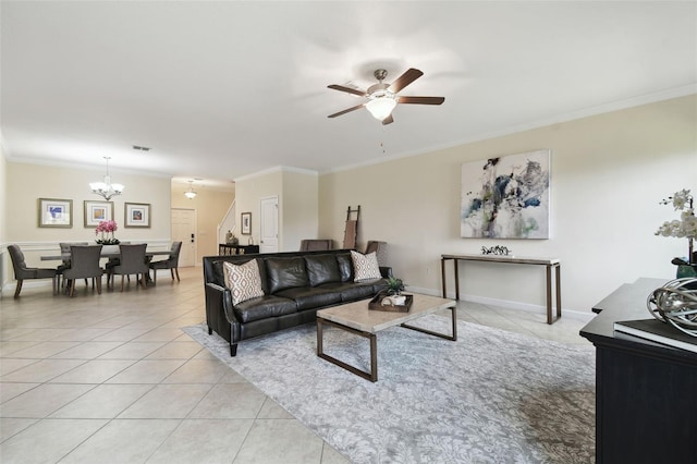 tiled living room featuring ceiling fan with notable chandelier and ornamental molding