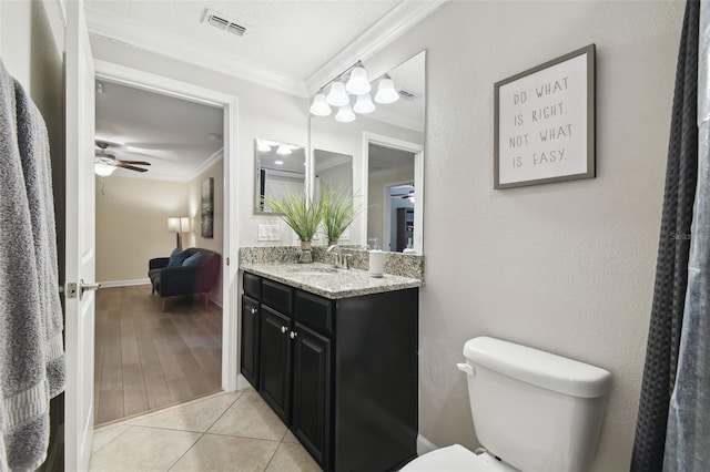 bathroom with vanity, ceiling fan, toilet, crown molding, and tile patterned floors