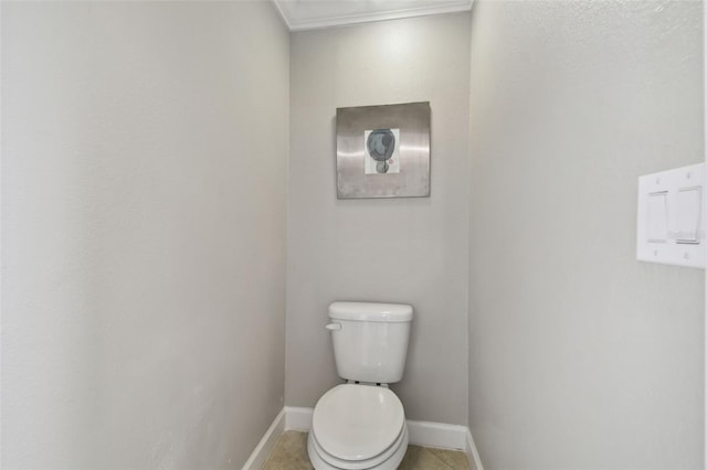 bathroom with tile patterned flooring and toilet