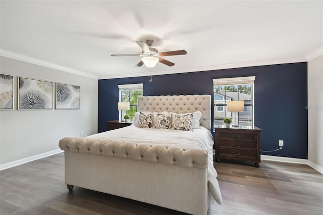 bedroom with crown molding, dark hardwood / wood-style floors, and ceiling fan