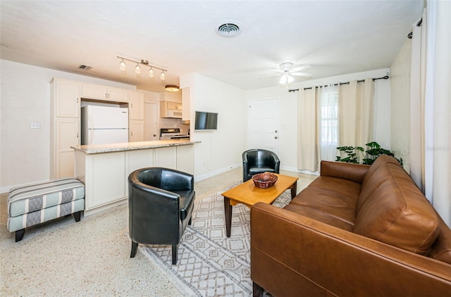 living room featuring ceiling fan