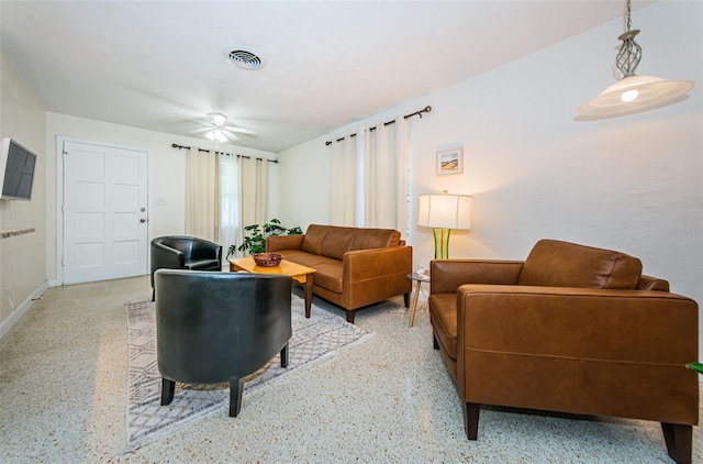 living room with ceiling fan