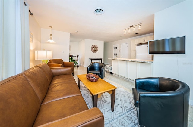 living room featuring rail lighting