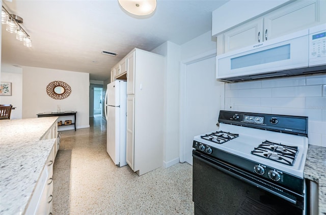 kitchen featuring white cabinetry, white appliances, light stone countertops, and decorative backsplash