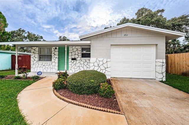 ranch-style home with a garage