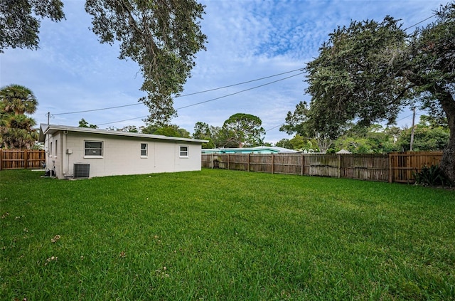 view of yard featuring central air condition unit