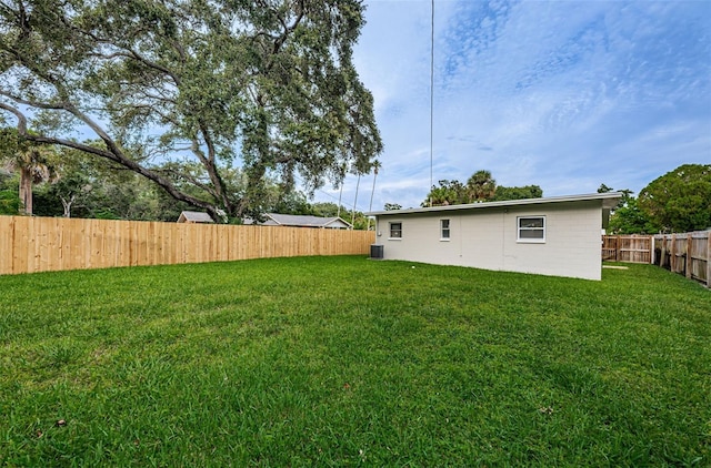 view of yard with central AC