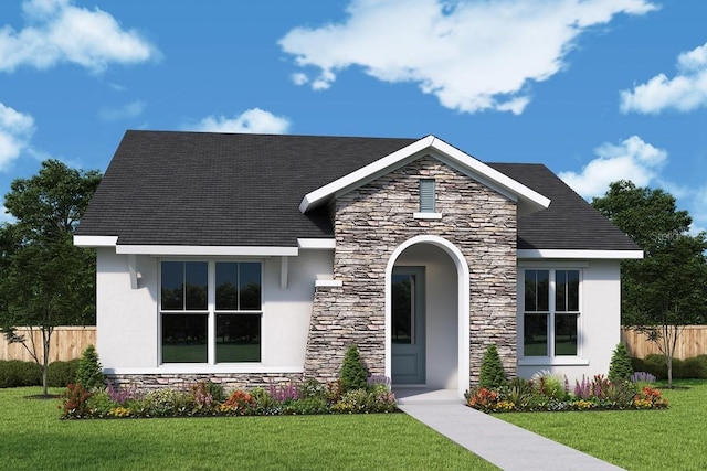 view of front of home with stone siding, stucco siding, a front lawn, and fence