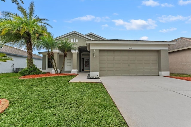 ranch-style home with a garage and a front yard