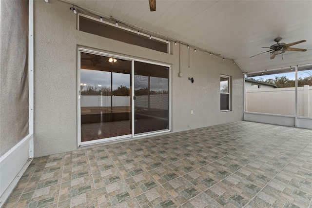 view of patio featuring ceiling fan