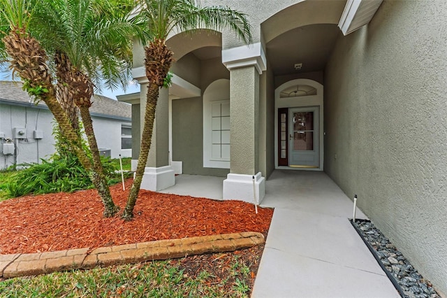 5809 War Admiral Dr, Wesley Chapel, FL 33544 - view of exterior entry featuring stucco siding