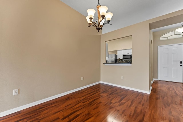5809 War Admiral Dr, Wesley Chapel, FL 33544 - foyer featuring a chandelier and dark wood finished floors
