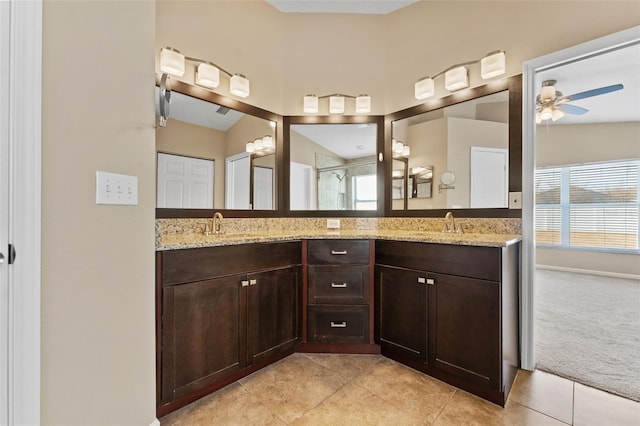 5809 War Admiral Dr, Wesley Chapel, FL 33544 - bathroom with a ceiling fan, double vanity, and plenty of natural light