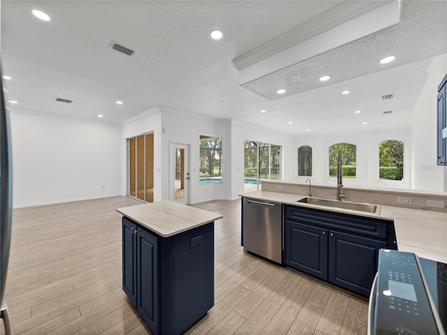 kitchen with sink, range, a center island, dishwasher, and light hardwood / wood-style floors