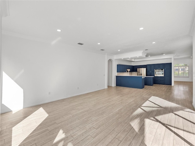 unfurnished living room featuring ornamental molding and light hardwood / wood-style floors