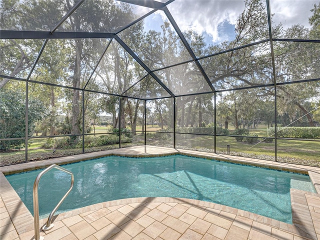 view of pool featuring a lanai and a patio area