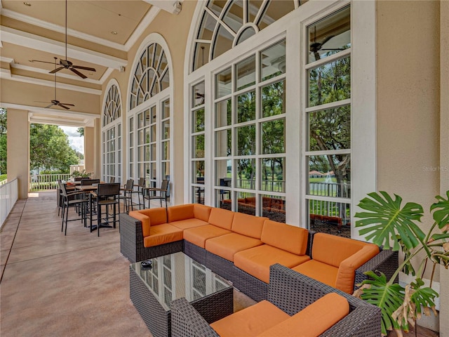 exterior space with an outdoor living space and ceiling fan