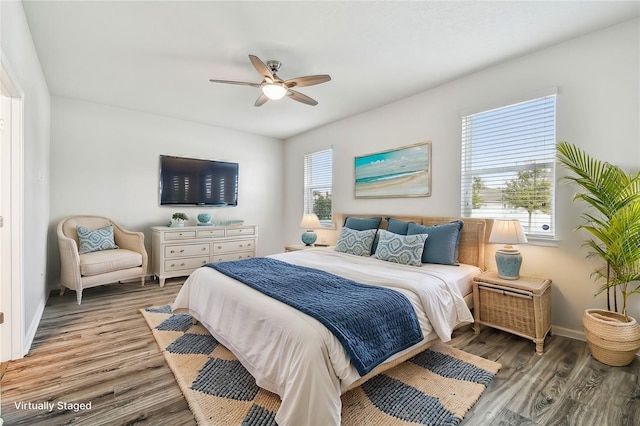 bedroom featuring hardwood / wood-style flooring and ceiling fan