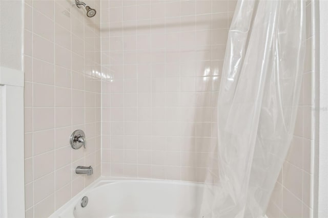 bathroom featuring shower / tub combo with curtain