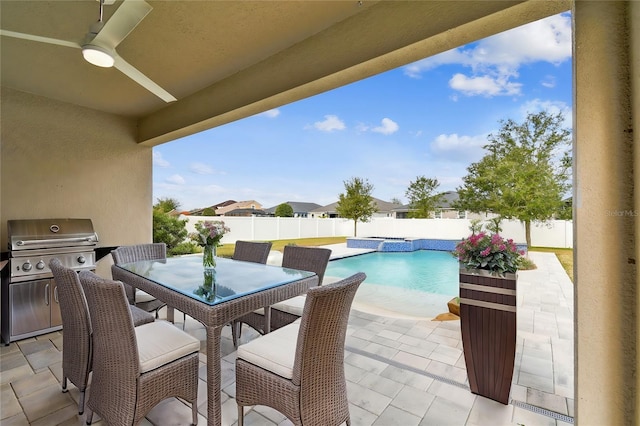 view of patio featuring a fenced in pool, grilling area, and ceiling fan