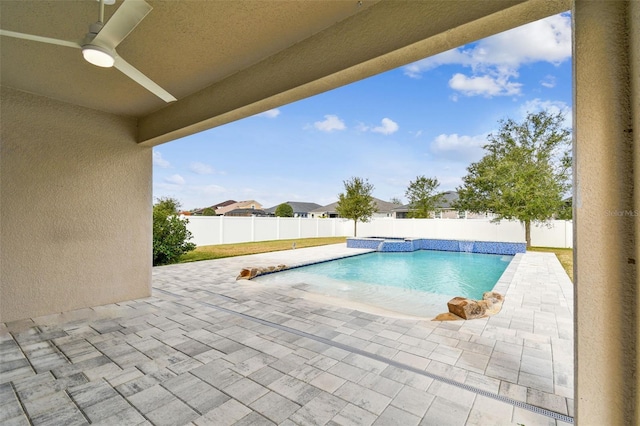 view of pool with a patio area and ceiling fan