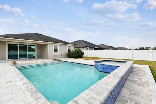 view of pool with a patio and an in ground hot tub