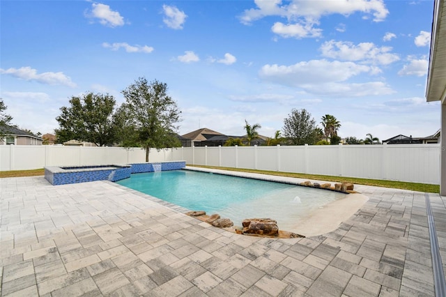 view of swimming pool with an in ground hot tub, pool water feature, and a patio