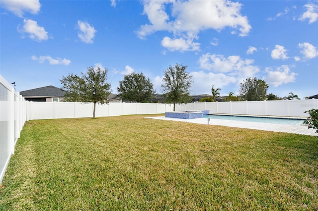 view of yard featuring a fenced in pool and a patio